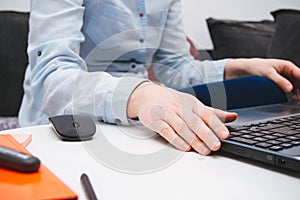 Female hands holding laptop  in office