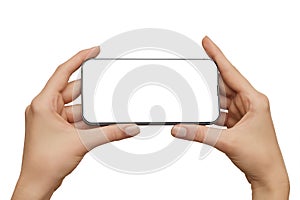 Female hands holding modern mobile phone with blank screen with clipping path isolated at white background. Cellphone mockup.
