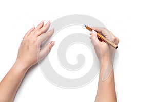 Female hands holding pencil, isolated on white background. File contains a path to isolation