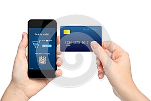 female hands holding phone and credit card making a purchase onlain