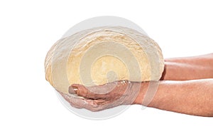 Female hands holding raw dough on white background. Hands holding a finished clean dough. Hands holding dough ready for