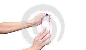 female hands holding shampoo bottle with copy space