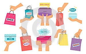 Female hands holding shopping bags from sale. Discount in retail, women hold colorful paper bag. Decent gift or present
