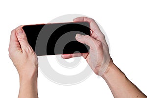 Female hands holding smartphone with black screen taking photo isolated on white