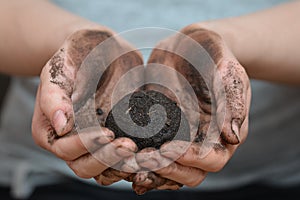 Female hands holding soil ball. Ecology and environment, earth care concept.