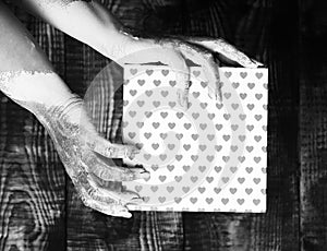 Female hands holding valentine present