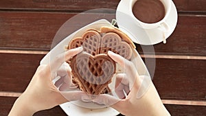 Female hands holding waffle dish