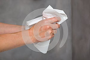 Female hands holding white towel