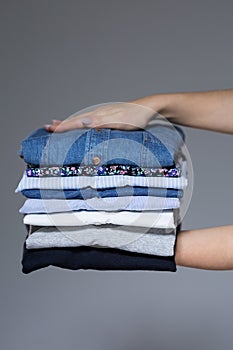 Female hands with ironed clothes