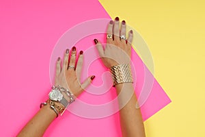 Female hands with jewelry. Fashion accessories, wrist watches, glamor bracelets