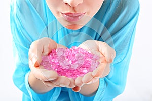 Female hands they keep colored crystals