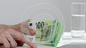 Female hands are keeping euro banknotes. Closeup