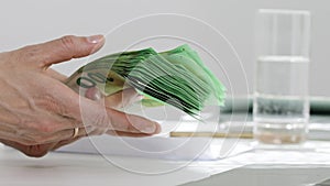 Female hands are keeping euro banknotes. Closeup