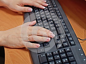 Female hands at keyboard