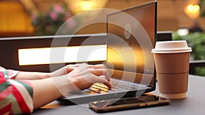 Female hands on keyboard, woman working on a laptop, girl typing on a notebook