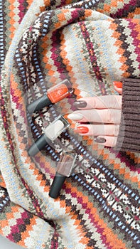 Female hands with long nails with brown nail polish