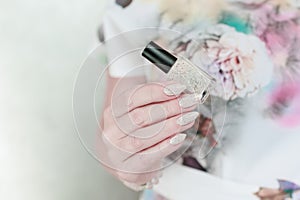 female hands with long nails light pastel manicure