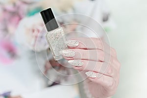 female hands with long nails light pastel manicure
