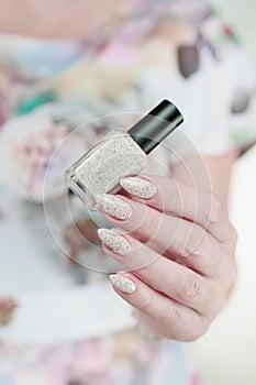 female hands with long nails light pastel manicure