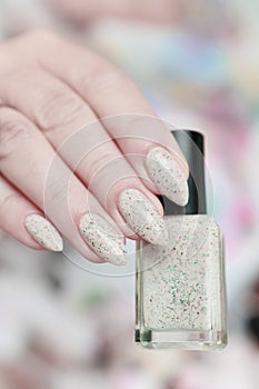 female hands with long nails light pastel manicure