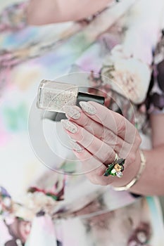 female hands with long nails light pastel manicure