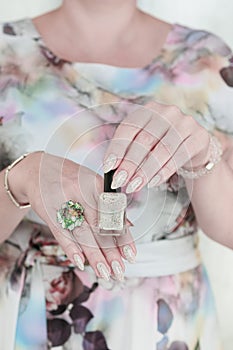 female hands with long nails light pastel manicure