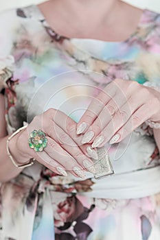 female hands with long nails light pastel manicure