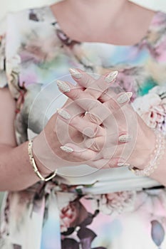 female hands with long nails light pastel manicure