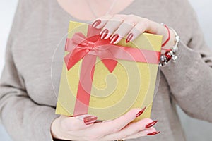 Female hands with long nails and red manicure