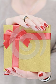 Female hands with long nails and red manicure