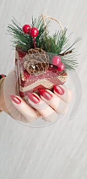 Female hands with long nails with red nail polish