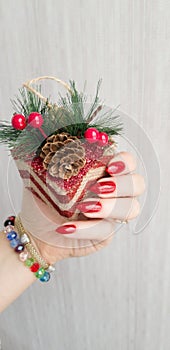 Female hands with long nails with red nail polish