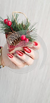 Female hands with long nails with red nail polish