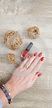 Female hands with long nails with red nail polish