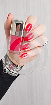Female hands with long nails with red nail polish