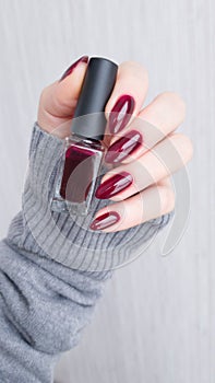 Female hands with long nails with red nail polish