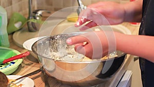 Female hands making dough balls for frying