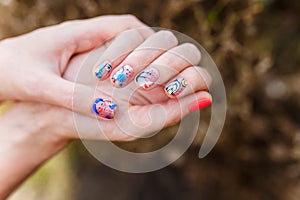 Female hands with modern bright manicure. Hand care, fingernails design, beauty and health concept.