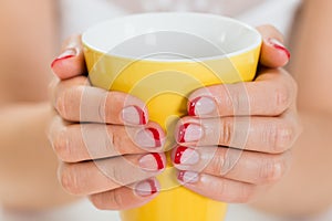 Female Hands With Nail Varnish Holding Mug