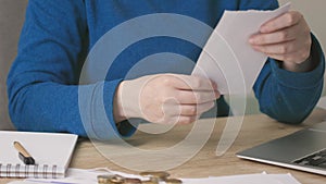 female hands opening envelope letter document or bills, reading, writing down