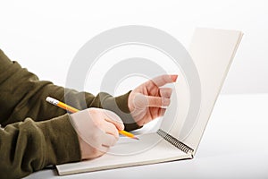 Female hands with pen writing and working notebook