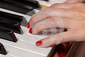 Female hands of a piano player