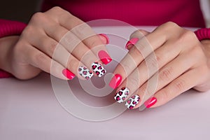 Female hands with pink manicure nails