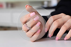 Female hands with pink manicure nails