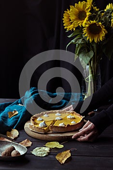 Female hands placing pie on table