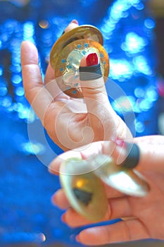 Female hands playing finger cymbals photo