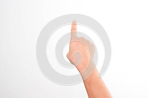 Female hands pointing at something or touching virtual screen on white background, closeup. Hand simulating pressing a button