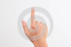 Female hands pointing at something or touching virtual screen on white background, closeup. Hand simulating pressing a button