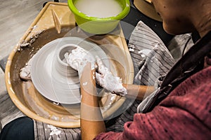 Female hands of a potter. Potter making ceramic pot on the pottery wheel. Concept for woman in freelance, business, hobby