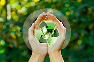 Female hands with recycle logo